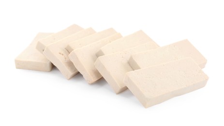 Photo of Slices of delicious raw tofu on white background