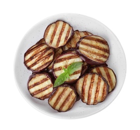 Photo of Delicious grilled eggplant slices with basil isolated on white, top view