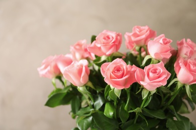 Photo of Bouquet of beautiful roses on blurred background