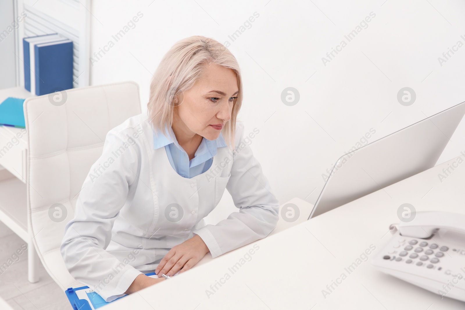 Photo of Senior female receptionist working in hospital