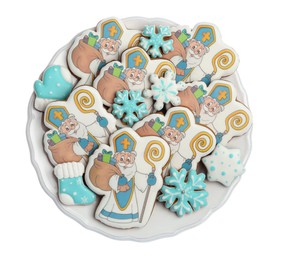 Photo of Tasty gingerbread cookies on white background, top view. St. Nicholas Day celebration