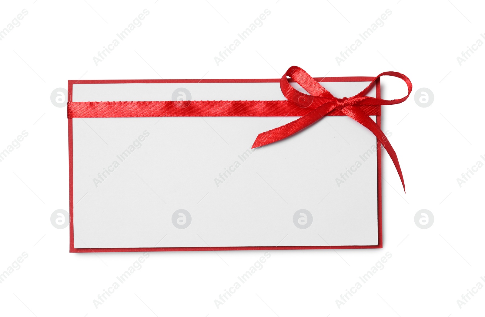 Photo of Blank gift card with red bow isolated on white, top view