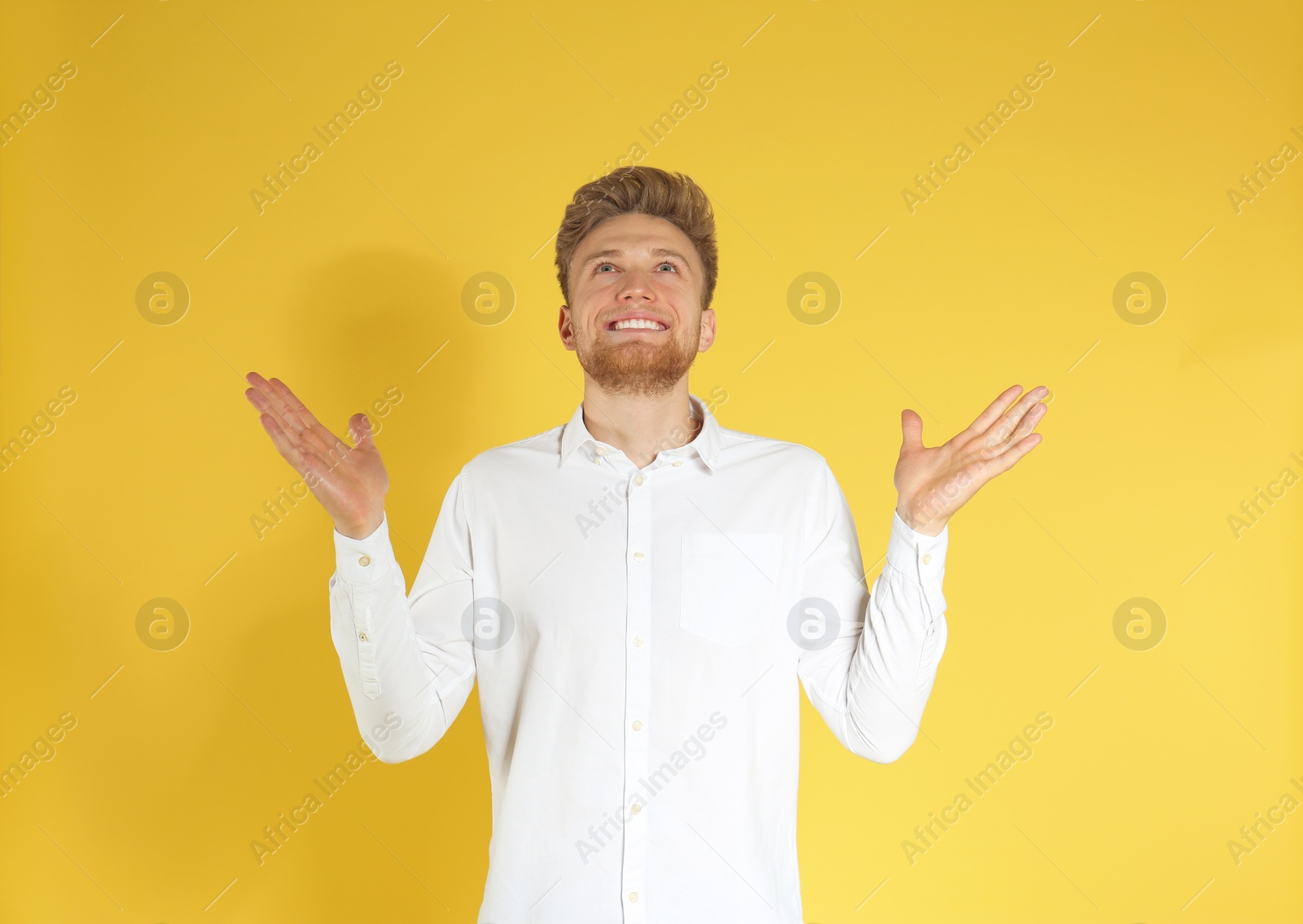 Photo of Portrait of handsome emotional man on color background