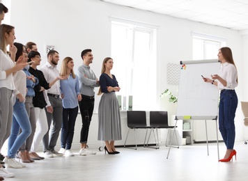 Female business trainer giving lecture in office