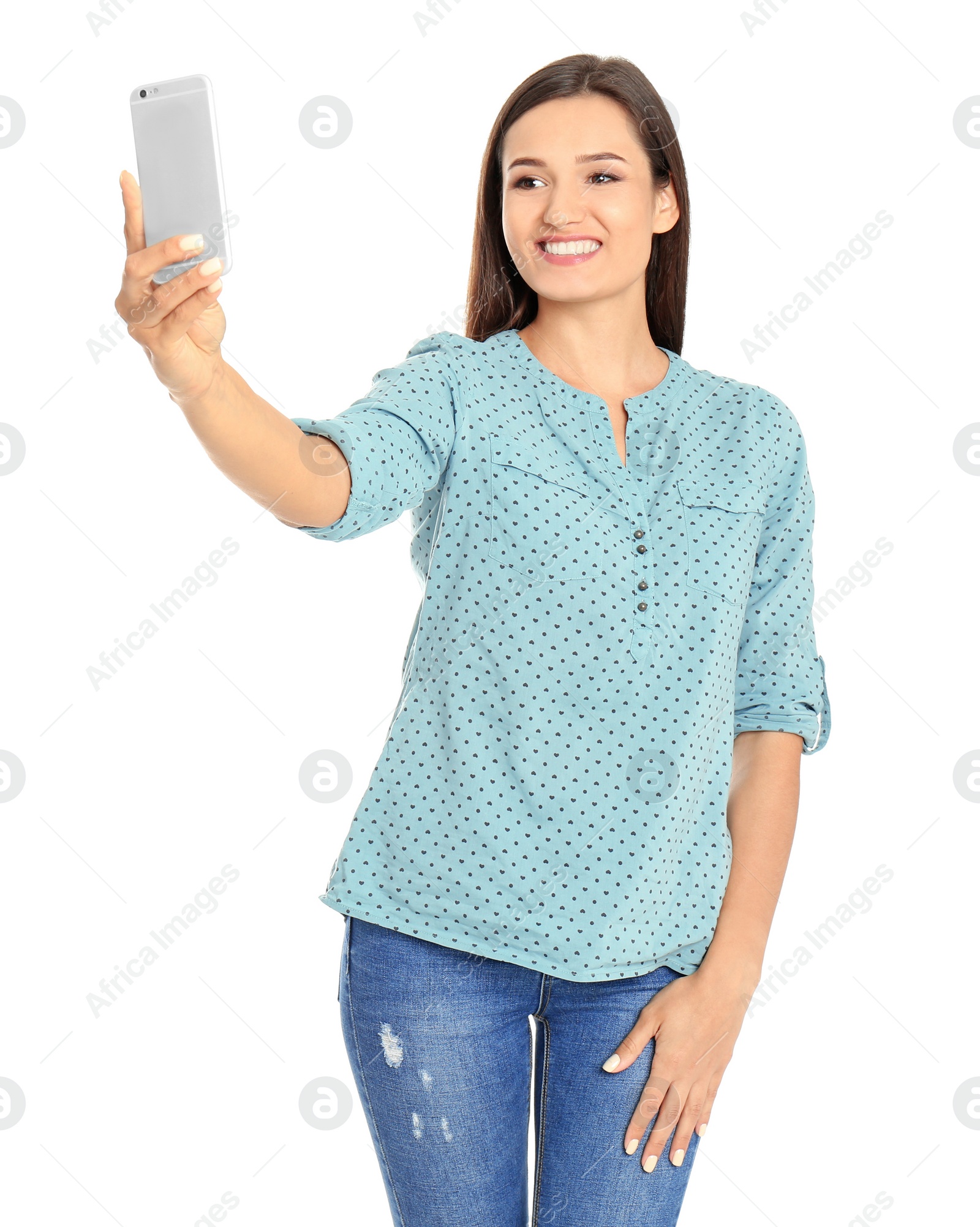 Photo of Young beautiful woman taking selfie against white background