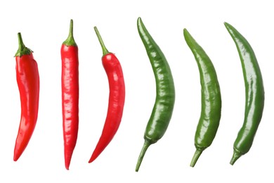 Set with red and green hot chili peppers on white background