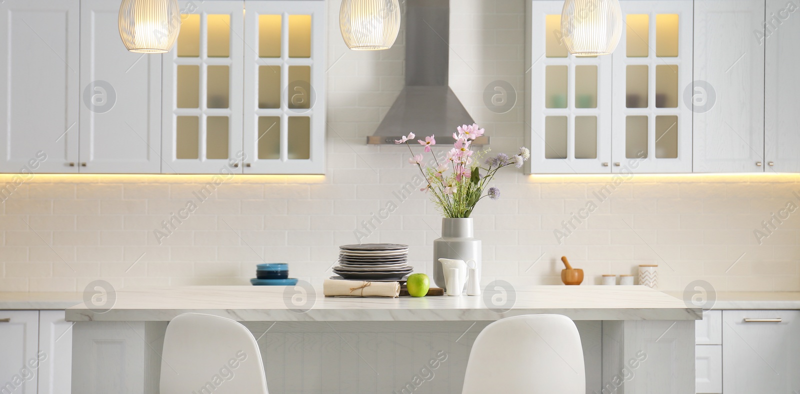 Image of Modern kitchen interior with stylish white furniture