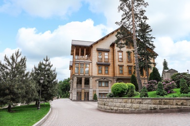 Photo of NOVI PETRIVTSI, UKRAINE - MAY 22, 2019: View of Honka club house in Mezhyhirya national park (estate of former president Viktor Yanukovych)