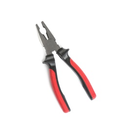 Photo of New pliers on white background, top view. Construction tools