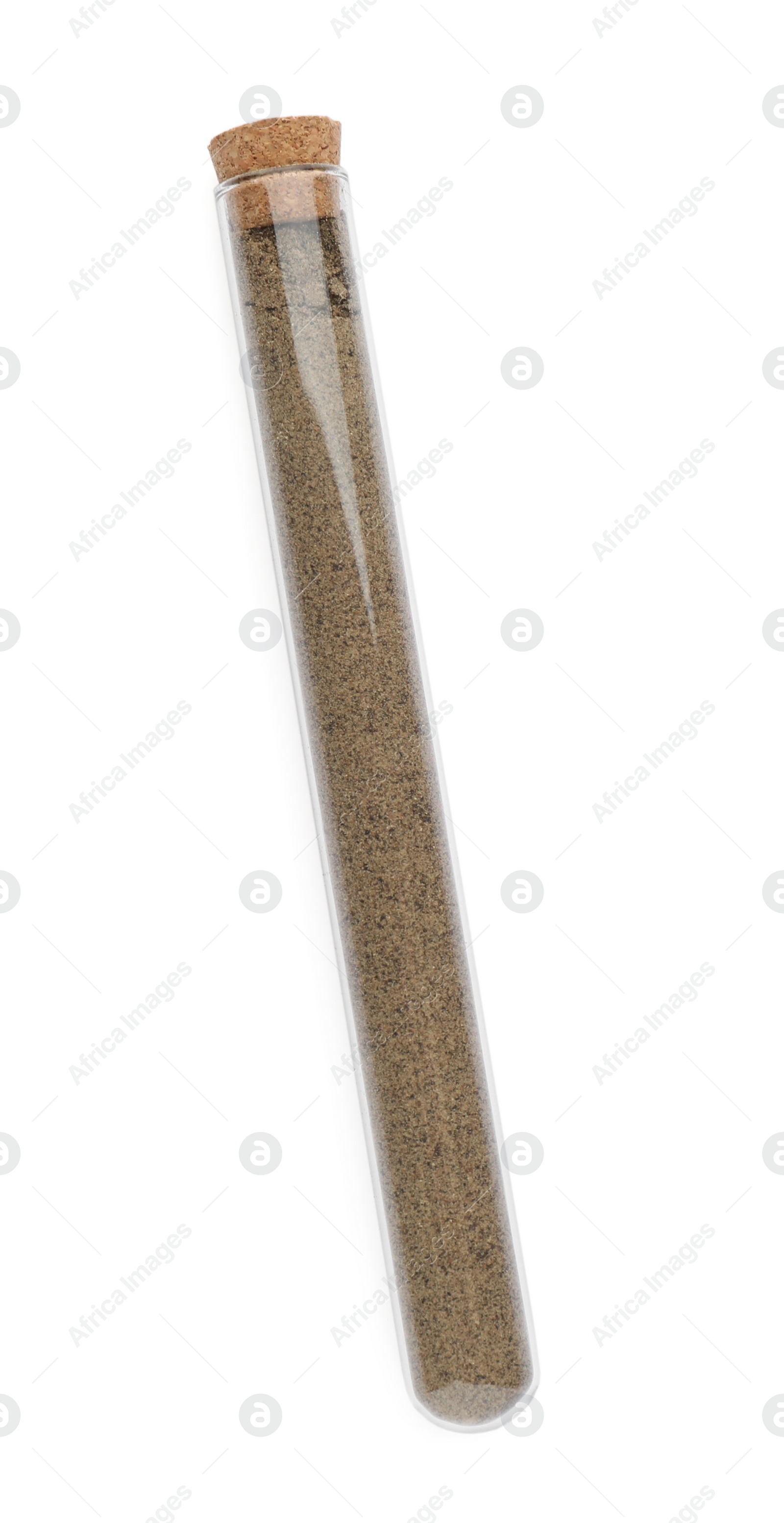 Photo of Glass tube with ground black pepper on white background, top view