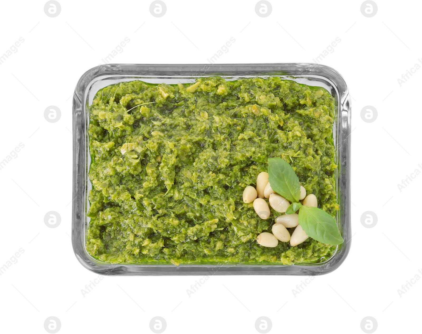 Photo of Delicious pesto sauce in bowl isolated on white, top view