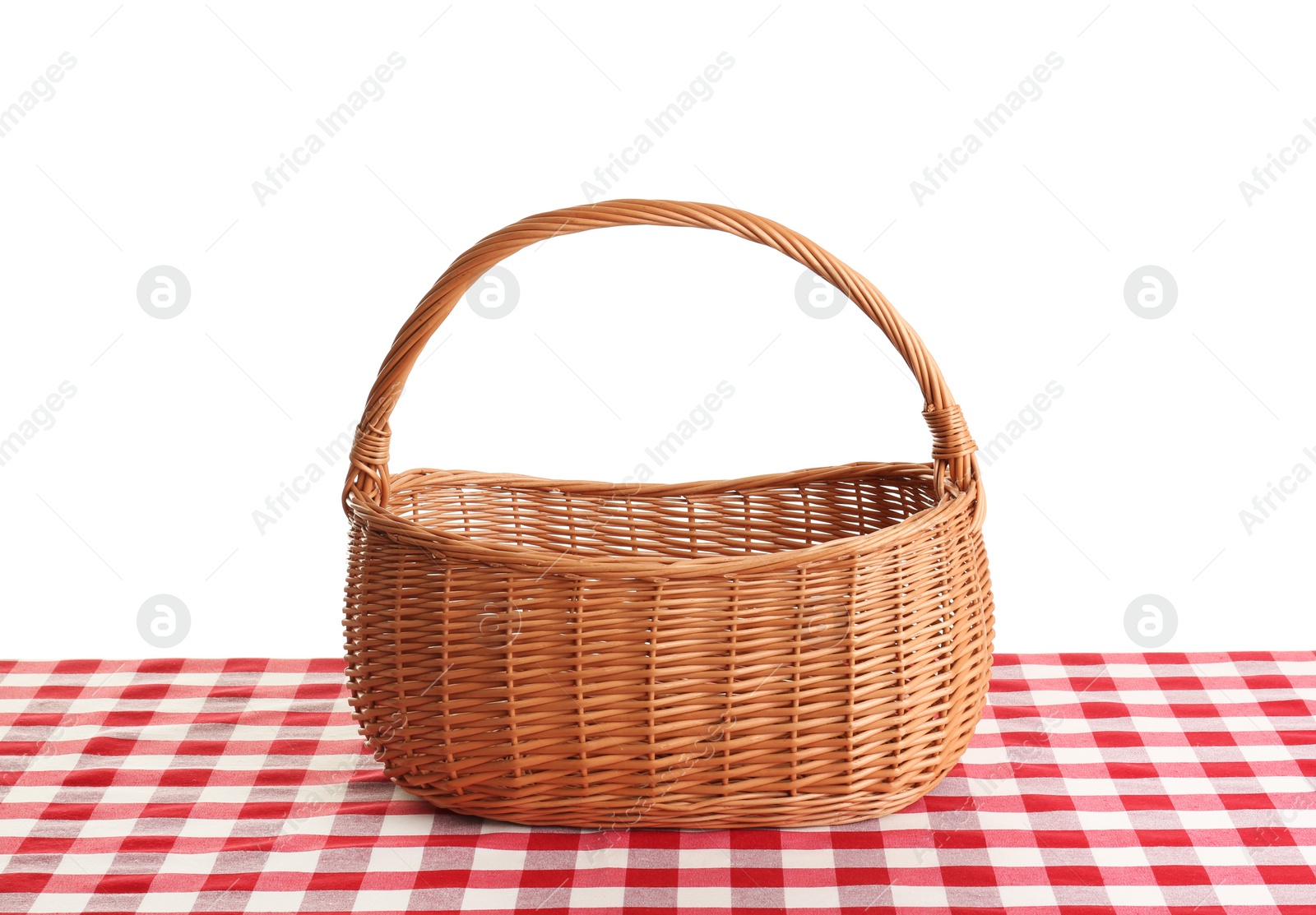 Photo of Empty picnic basket on checkered tablecloth against white background