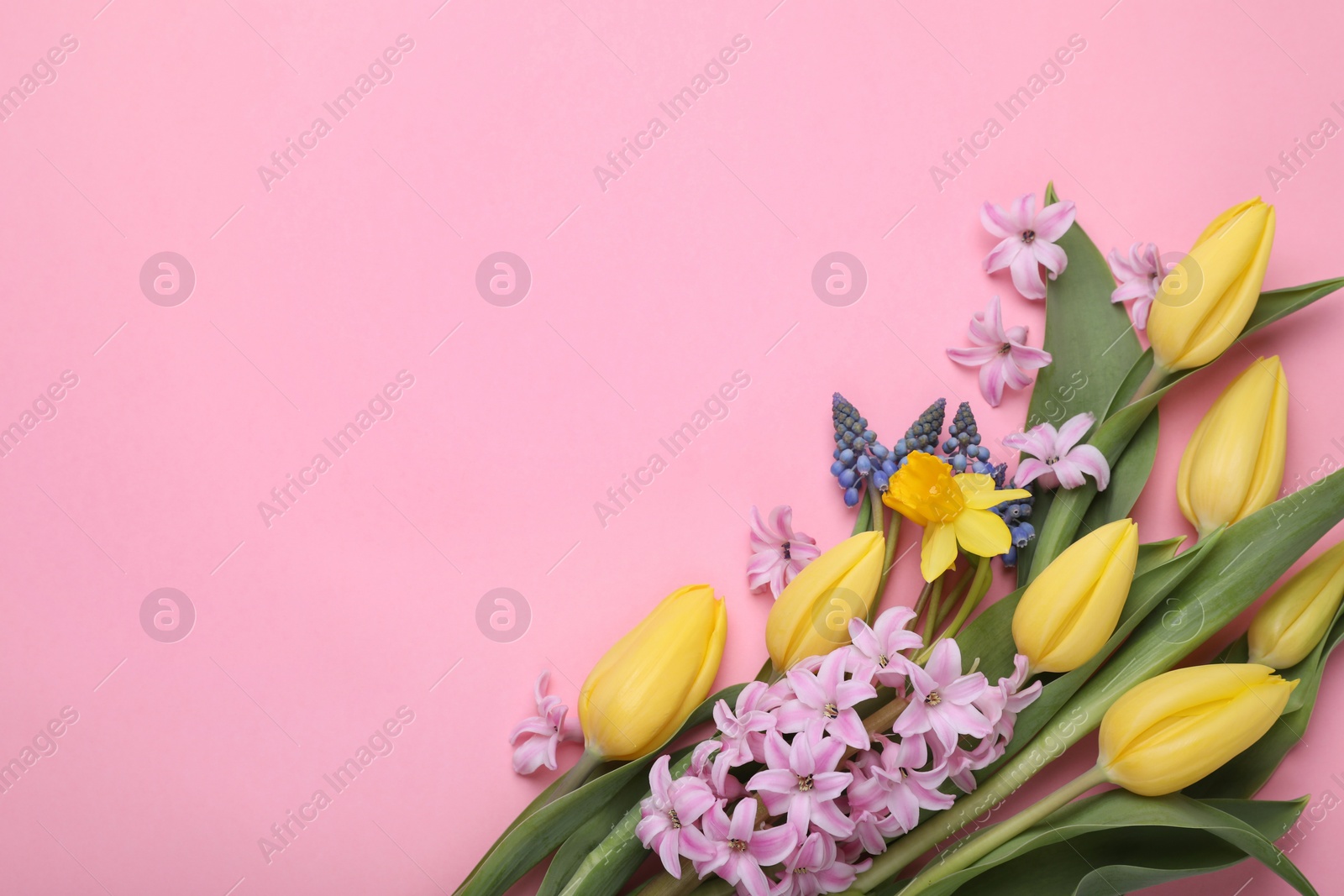 Photo of Beautiful bouquet with different flowers on pink background, flat lay. Space for text