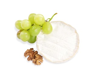 Photo of Brie cheese served with grape and walnuts isolated on white, top view