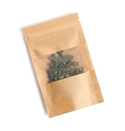 Craft paper bag with Tie Guan Yin Oolong tea on white background, top view