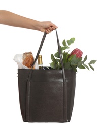 Woman holding leather shopper bag on white background, closeup