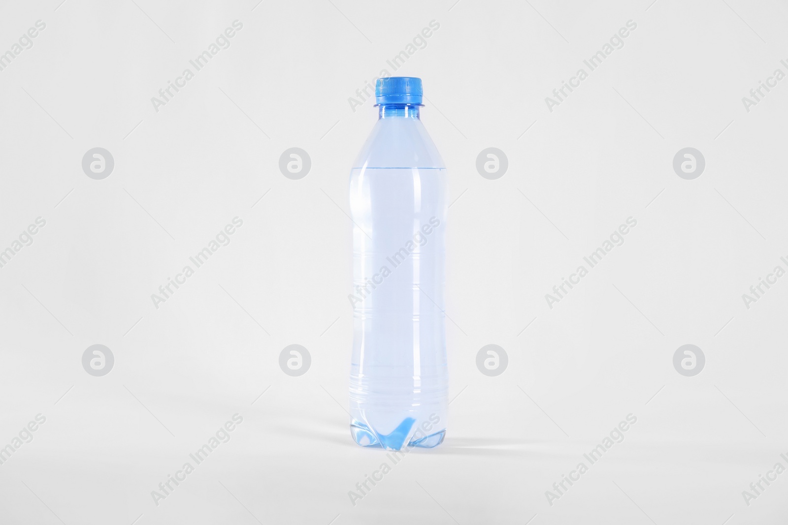 Photo of Plastic bottle with pure water isolated on white