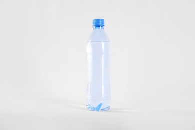 Photo of Plastic bottle with pure water isolated on white