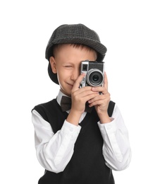 Photo of Cute little detective taking photo with vintage camera on white background