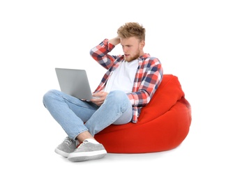 Emotional man with laptop on white background