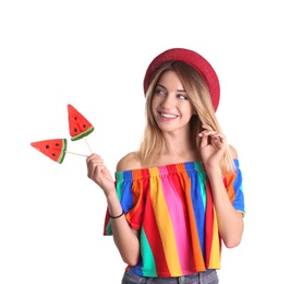 Young pretty woman with candies on white background