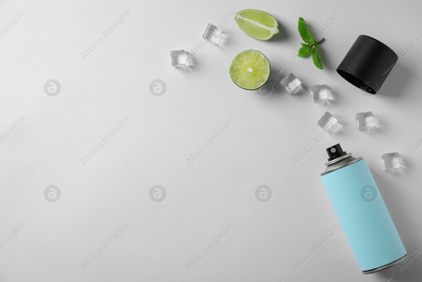 Photo of Composition with spray deodorant on white background, top view