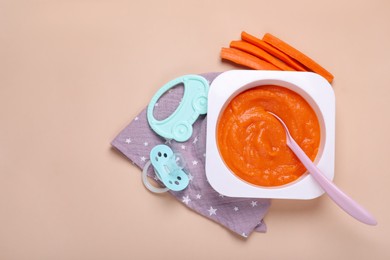 Photo of Flat lay composition with healthy baby food on beige background. Space for text
