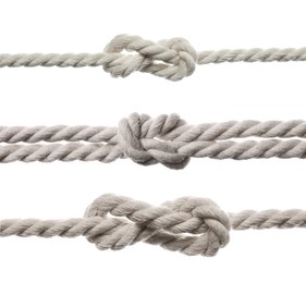 Set of cotton ropes with knots on white background, closeup
