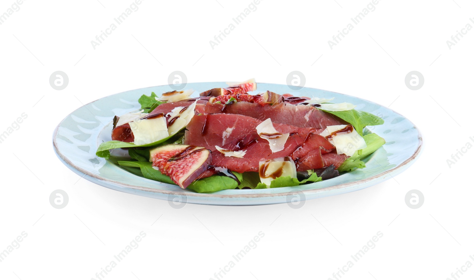 Photo of Plate with delicious bresaola salad isolated on white