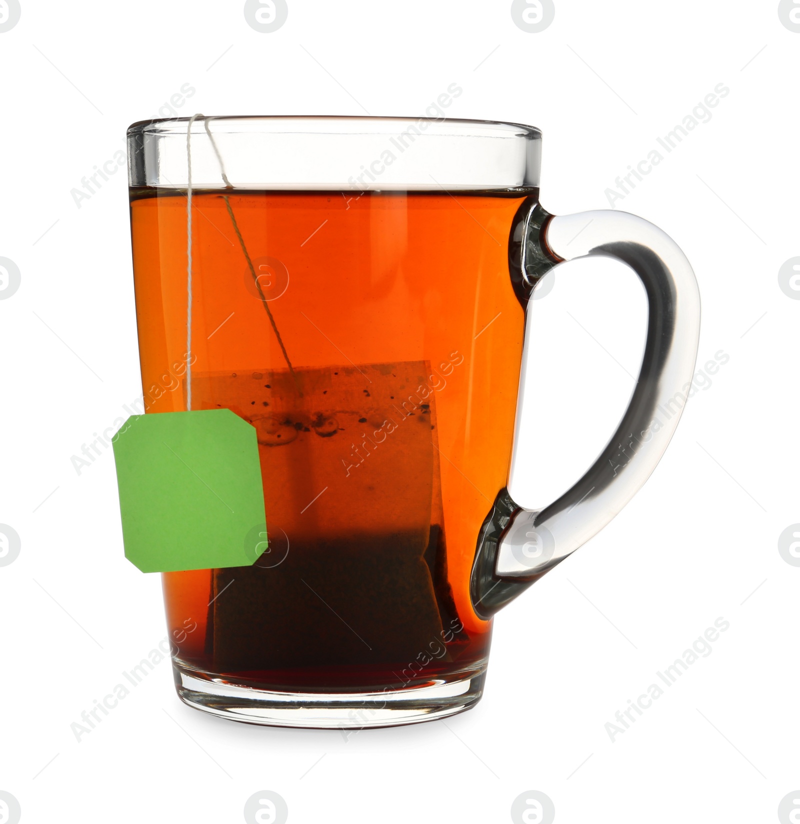 Photo of Tea bag in glass cup of hot water isolated on white