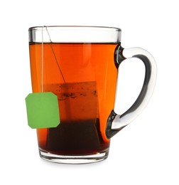 Photo of Tea bag in glass cup of hot water isolated on white