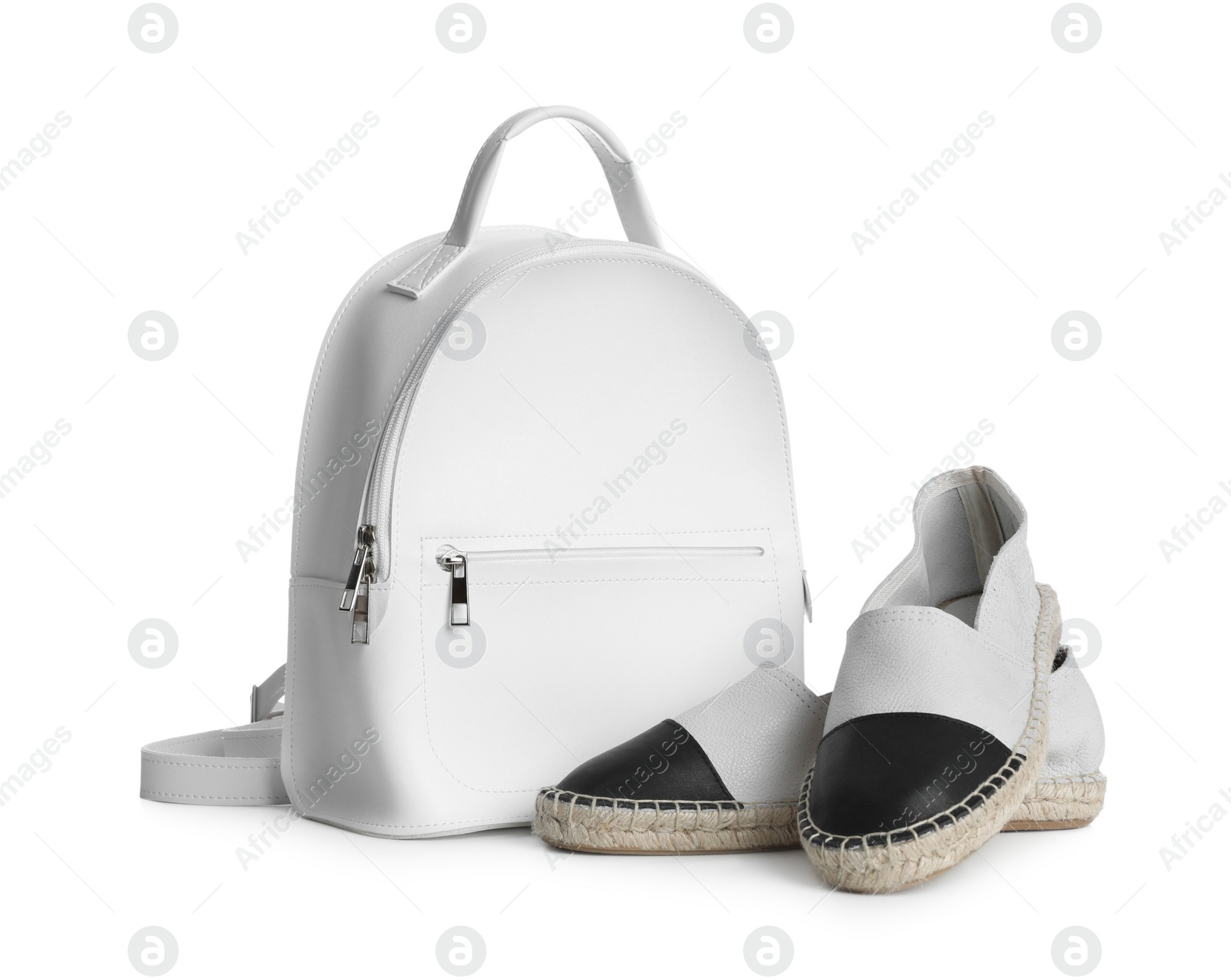 Photo of Stylish backpack with shoes isolated on white