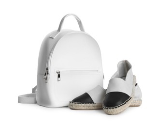Photo of Stylish backpack with shoes isolated on white