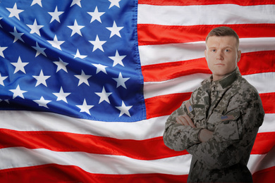 Male soldier and American flag on background. Military service