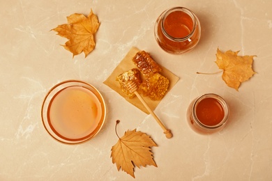 Flat lay composition with fresh honey on color background