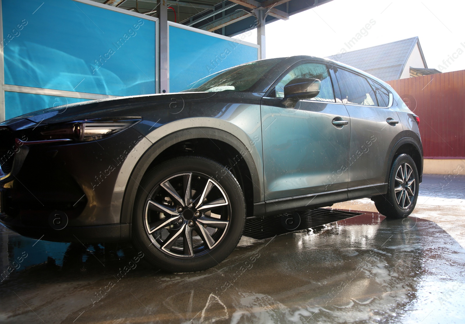 Photo of Clean wet automobile at professional car wash