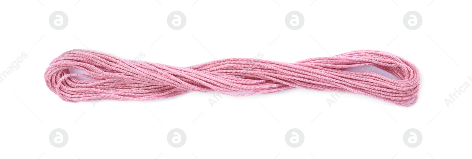 Photo of Pale pink embroidery thread on white background, top view