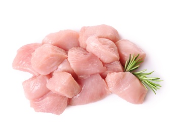 Cut raw turkey fillet with rosemary on white background, top view