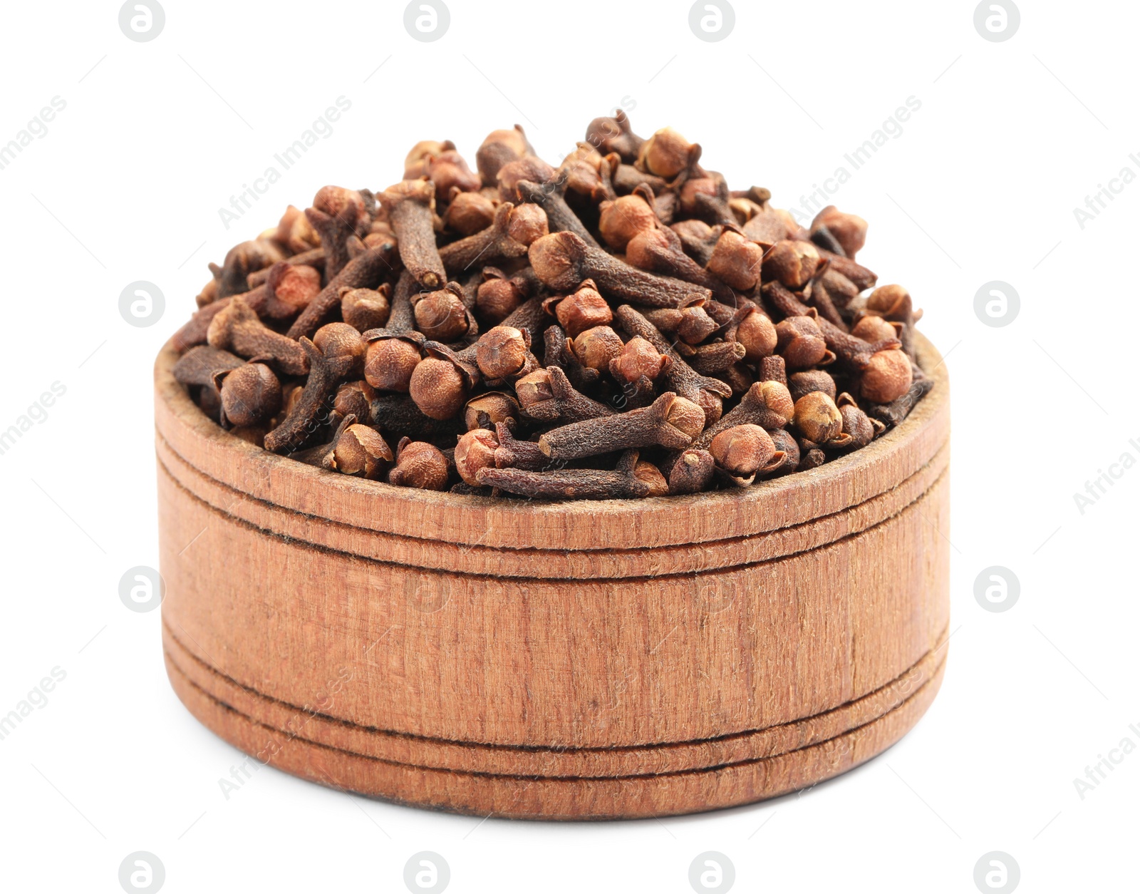 Photo of Aromatic dry cloves in wooden bowl isolated on white