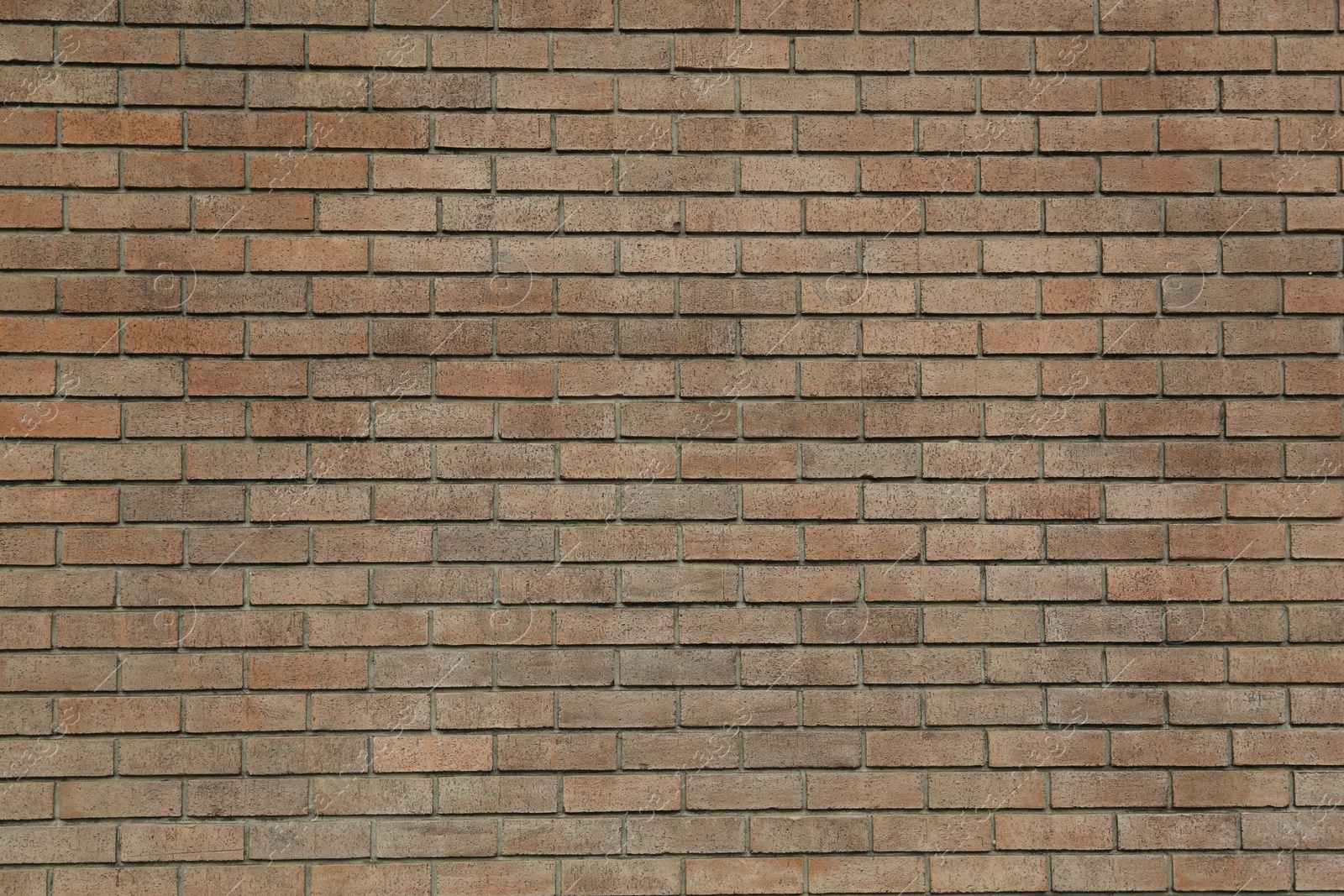 Photo of Texture of brown brick wall as background