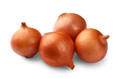 Many fresh unpeeled onions on white background