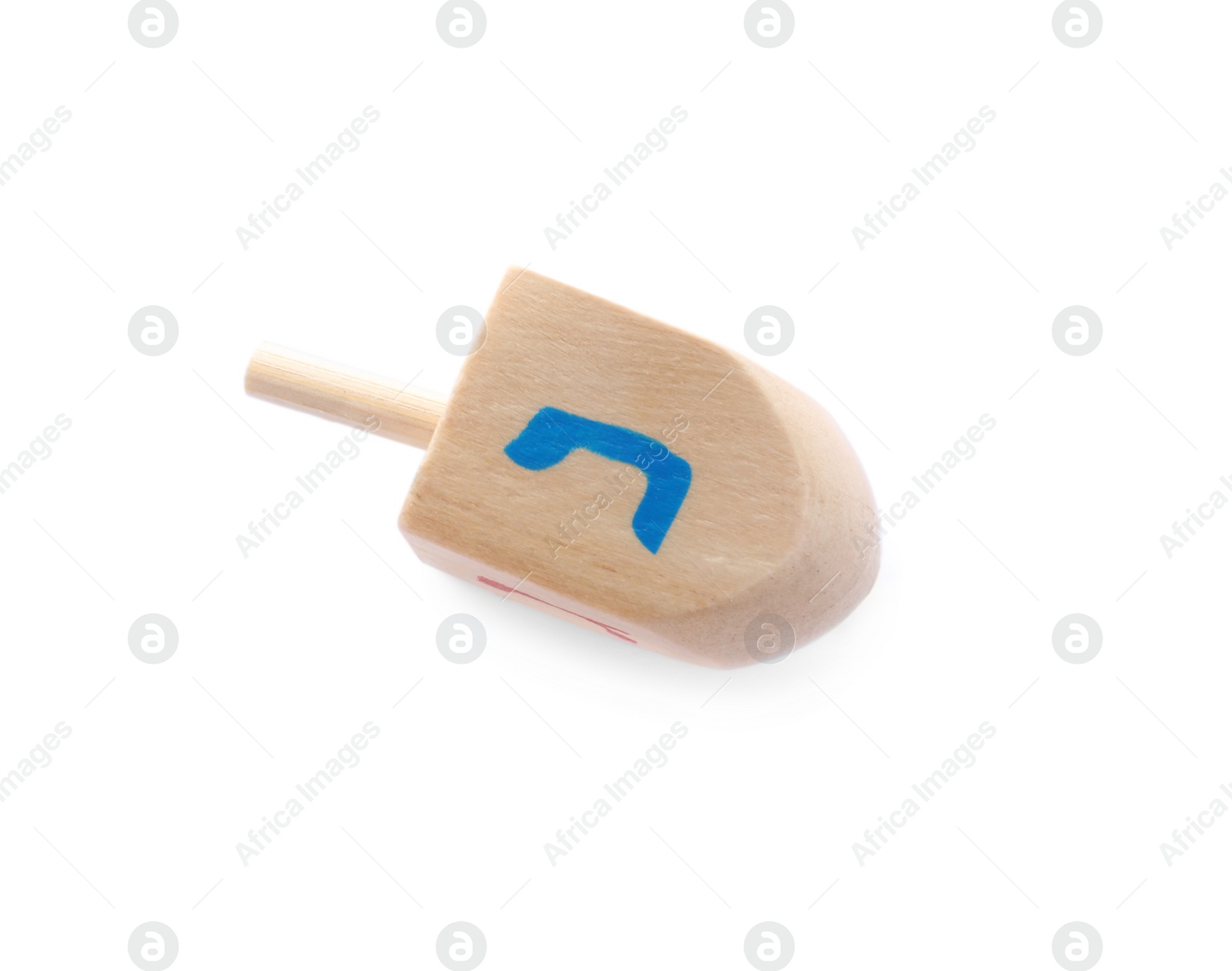 Photo of Wooden Hanukkah traditional dreidel with letter Nun isolated on white, top view