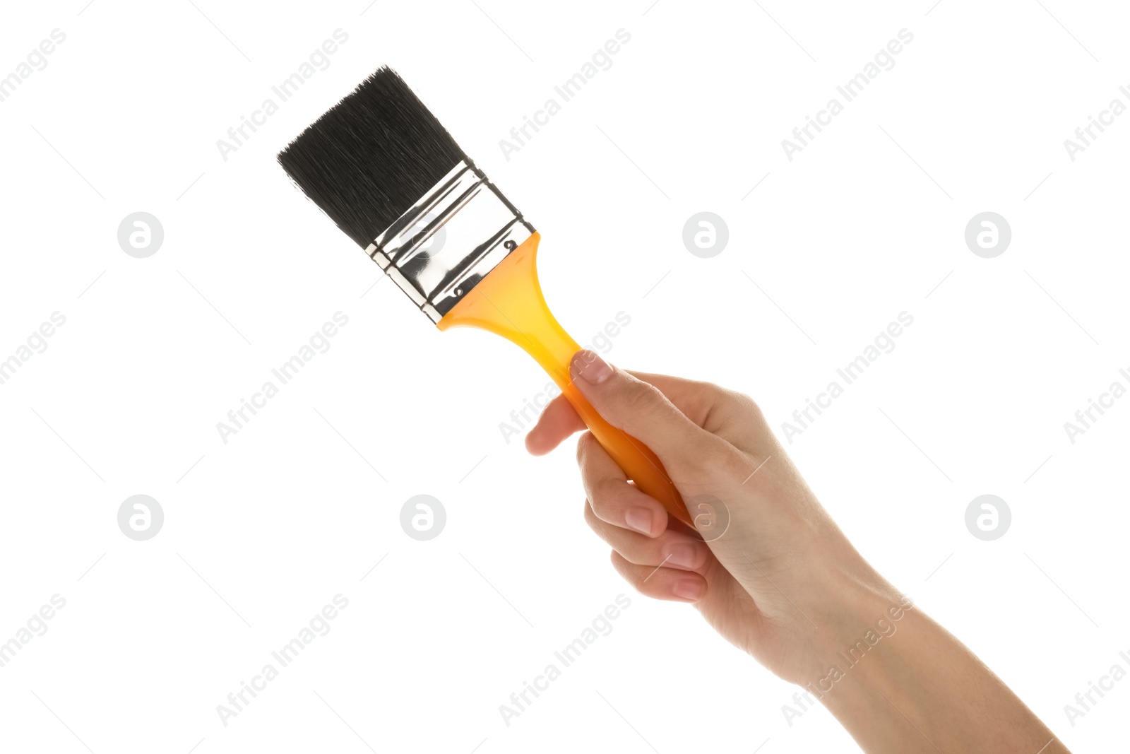 Photo of Woman holding paint brush on white background, closeup