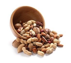 Photo of Overturned bowl with mixed organic nuts on white background