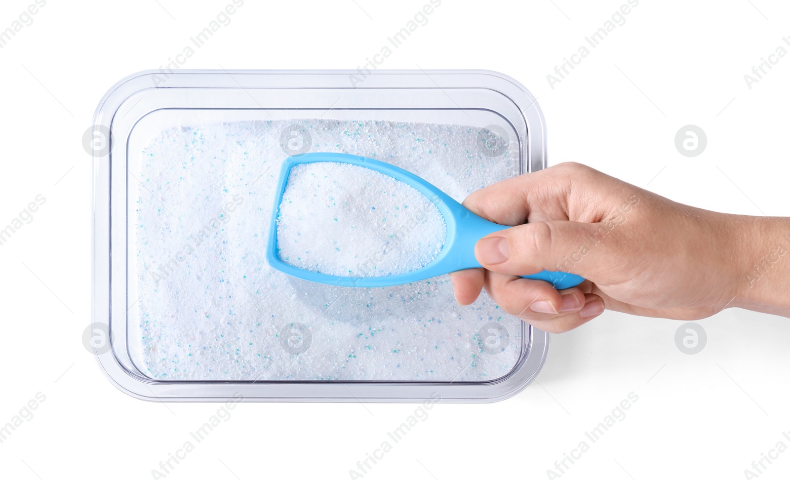 Photo of Woman holding scoop of laundry powder over container isolated on white, top view