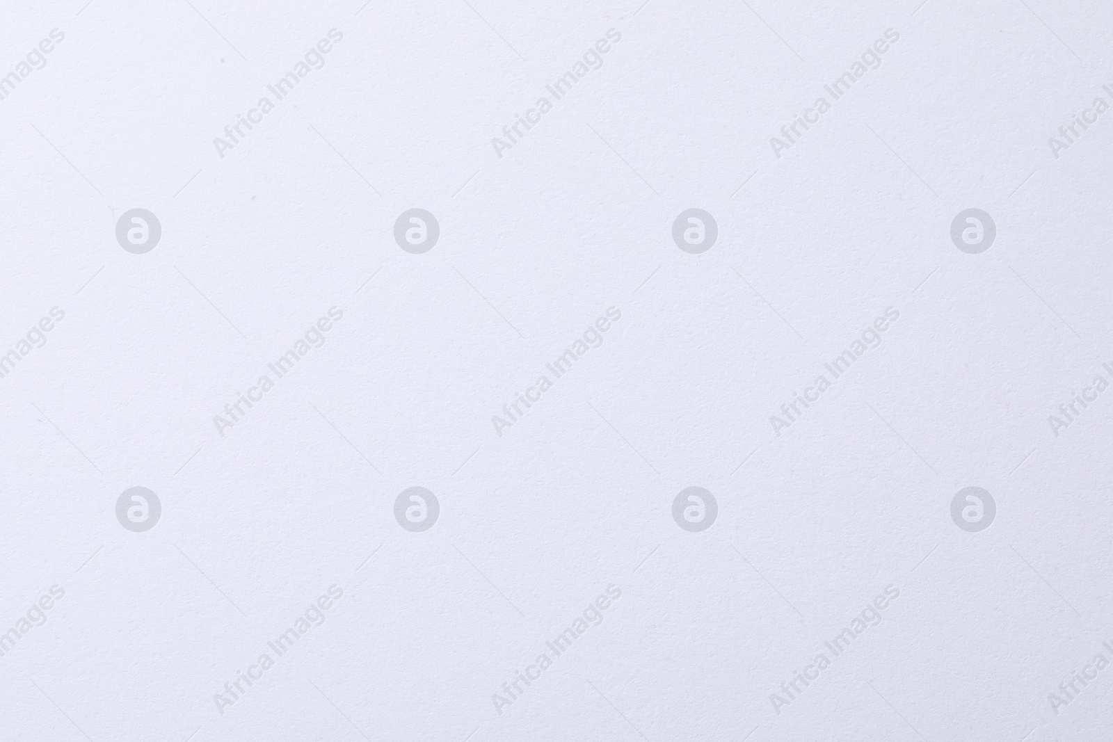 Photo of Texture of white paper sheet as background, closeup