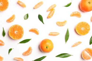 Photo of Composition with tangerines and leaves on white background, top view