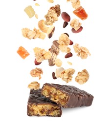 Tasty chocolate glazed protein bars and granola with nuts and dried fruits falling on white background
