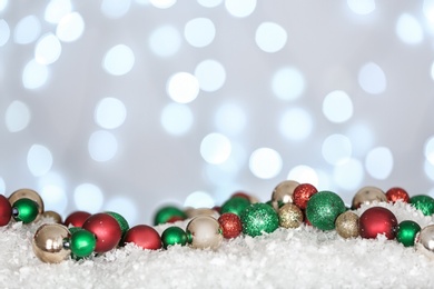 Christmas decoration on snow against blurred background