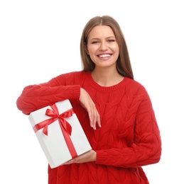 Photo of Happy young woman with Christmas gift on white background